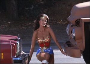 Wonder Woman stops both a car and a truck from driving away by lifting them off the ground.