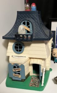 Close-up of a plastic toy haunted house.